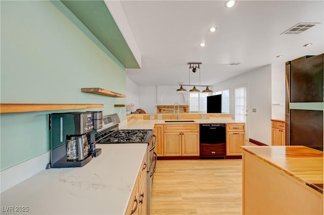 7528 Golden Yucca Dr, Las Vegas, NV 89147 - kitchen with dishwasher, gas stove, recessed lighting, light brown cabinetry, and light wood-style flooring