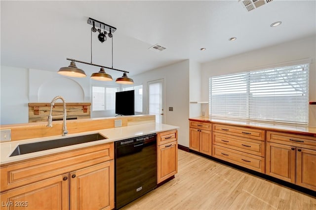 7528 Golden Yucca Dr, Las Vegas, NV 89147 - kitchen featuring dishwasher, light wood-style floors, light countertops, healthy amount of natural light, and recessed lighting