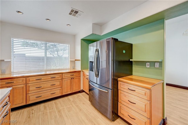 7528 Golden Yucca Dr, Las Vegas, NV 89147 - kitchen featuring stainless steel fridge, light countertops, light wood-style floors, and recessed lighting