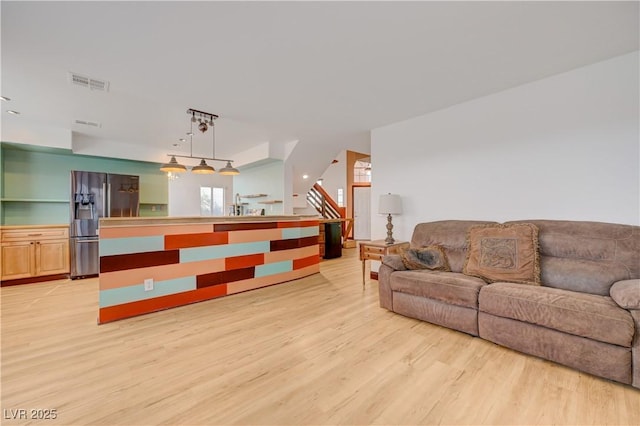 7528 Golden Yucca Dr, Las Vegas, NV 89147 - living room featuring light wood finished floors and stairs