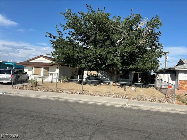 712 Donner St, Las Vegas, NV 89107 - view of front of house featuring a fenced front yard, driveway, and an attached garage