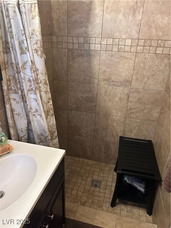 712 Donner St, Las Vegas, NV 89107 - full bathroom with vanity and a tile shower