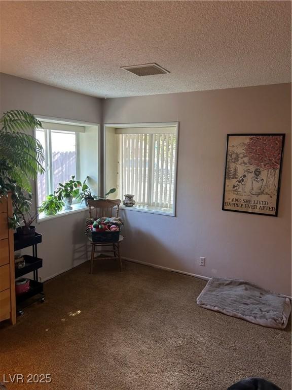 712 Donner St, Las Vegas, NV 89107 - unfurnished room featuring carpet, a textured ceiling, and baseboards