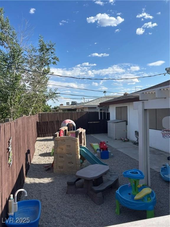 712 Donner St, Las Vegas, NV 89107 - view of yard with a playground and a patio area
