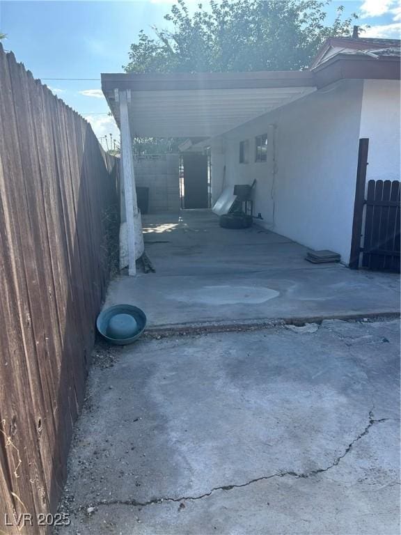 712 Donner St, Las Vegas, NV 89107 - back of house featuring stucco siding and a carport