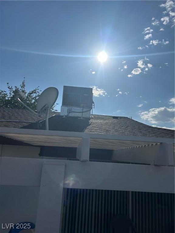 712 Donner St, Las Vegas, NV 89107 - exterior view of cooling unit and a shingled roof