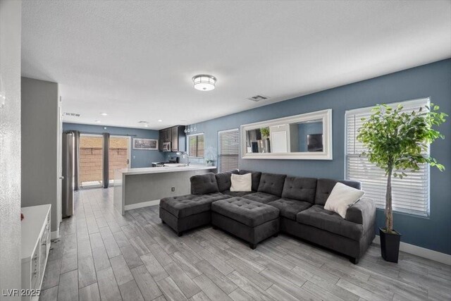 106 Basketflower Ct, Las Vegas, NV 89183 - living room featuring light wood-style floors and baseboards