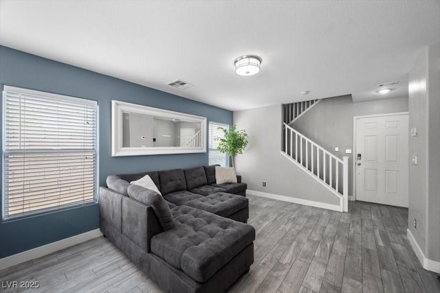 106 Basketflower Ct, Las Vegas, NV 89183 - living area with stairs, wood finished floors, and baseboards
