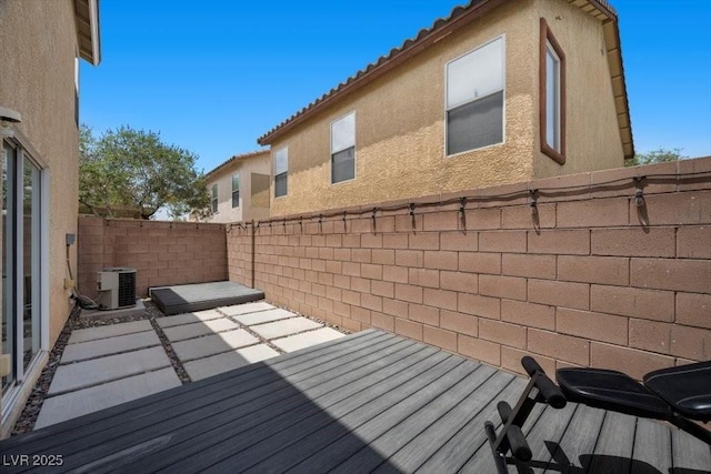 106 Basketflower Ct, Las Vegas, NV 89183 - deck with a fenced backyard, central AC unit, and a patio area