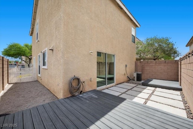 106 Basketflower Ct, Las Vegas, NV 89183 - wooden deck featuring a fenced backyard, central AC, and a patio