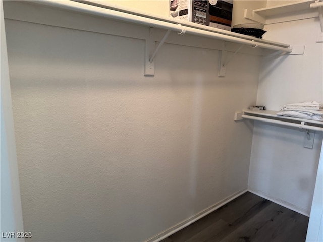 4555 E Sahara Ave Unit 288, Las Vegas, NV 89104 - walk in closet featuring dark wood-type flooring