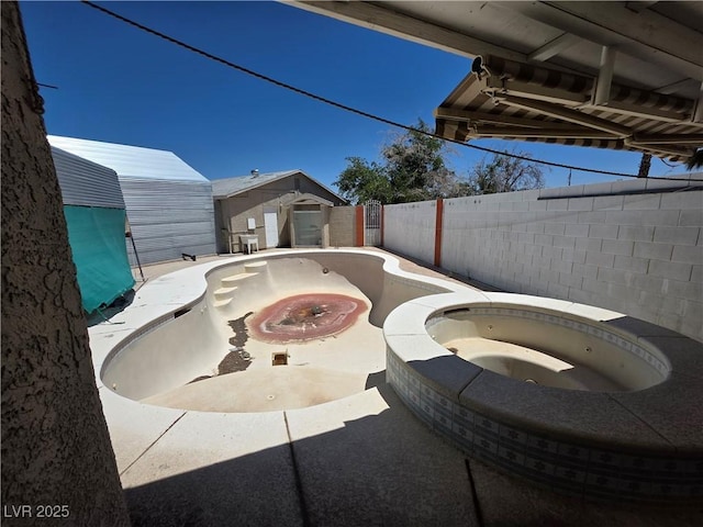 7108 Moon Ct, Las Vegas, NV 89145 - fenced backyard featuring an in-ground hot tub