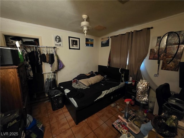 7108 Moon Ct, Las Vegas, NV 89145 - bedroom featuring tile patterned floors, a closet, a ceiling fan, and ornamental molding