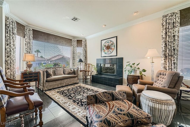 1609 Hidden Spring Dr, Las Vegas, NV 89117 - tiled living room with crown molding, plenty of natural light, a tile fireplace, and recessed lighting