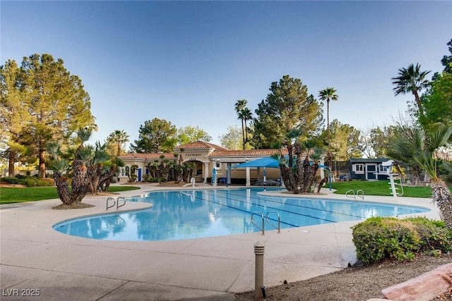 1609 Hidden Spring Dr, Las Vegas, NV 89117 - community pool featuring a yard and a patio area