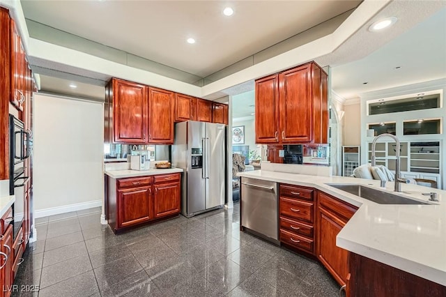 1609 Hidden Spring Dr, Las Vegas, NV 89117 - kitchen with appliances with stainless steel finishes, a sink, light countertops, recessed lighting, and granite floors