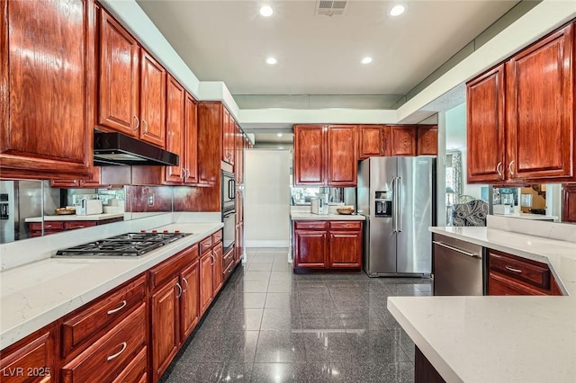1609 Hidden Spring Dr, Las Vegas, NV 89117 - kitchen with stainless steel appliances, under cabinet range hood, recessed lighting, baseboards, and granite tiled floors