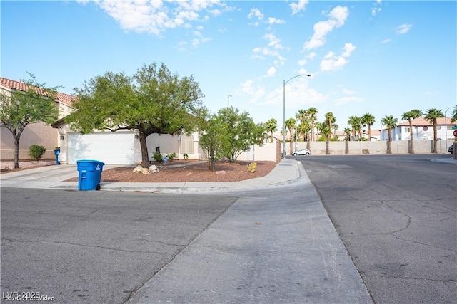 3913 Lilac Haze St, Las Vegas, NV 89147 - view of asphalt street with street lights and sidewalks