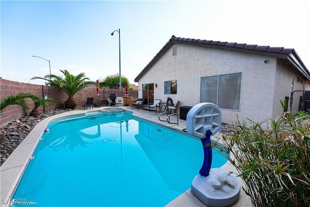 3913 Lilac Haze St, Las Vegas, NV 89147 - view of swimming pool with a fenced backyard, a patio area, and a pool with connected hot tub
