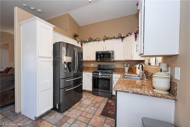 3913 Lilac Haze St, Las Vegas, NV 89147 - kitchen featuring appliances with stainless steel finishes, a sink, stone finish floors, white cabinetry, and light stone countertops