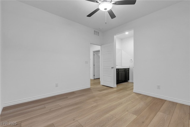 9570 Thistle Creek Ave, Las Vegas, NV 89178 - unfurnished bedroom with light wood-style flooring, baseboards, ensuite bath, and ceiling fan