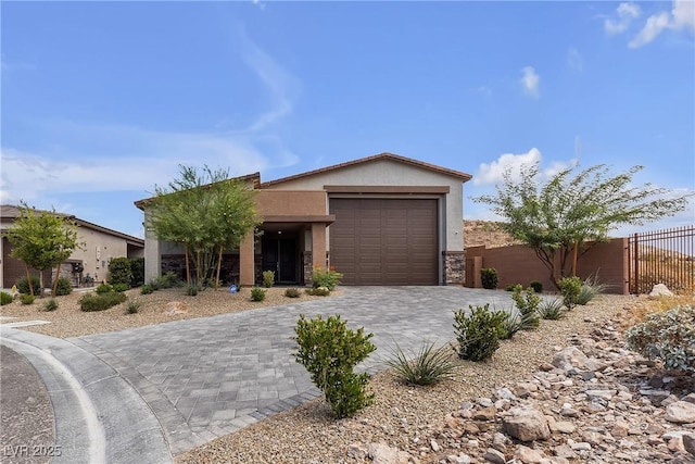 9570 Thistle Creek Ave, Las Vegas, NV 89178 - ranch-style home with stucco siding, decorative driveway, and an attached garage