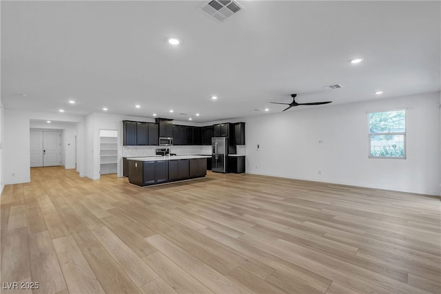 9570 Thistle Creek Ave, Las Vegas, NV 89178 - unfurnished living room with recessed lighting, ceiling fan, light wood-style flooring, and baseboards