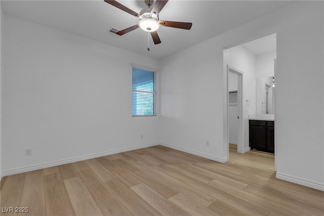 9570 Thistle Creek Ave, Las Vegas, NV 89178 - unfurnished room featuring light wood-style flooring, ceiling fan, and baseboards