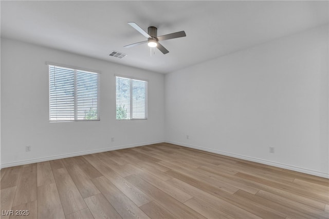 9570 Thistle Creek Ave, Las Vegas, NV 89178 - unfurnished room featuring a ceiling fan, light wood-style flooring, and baseboards