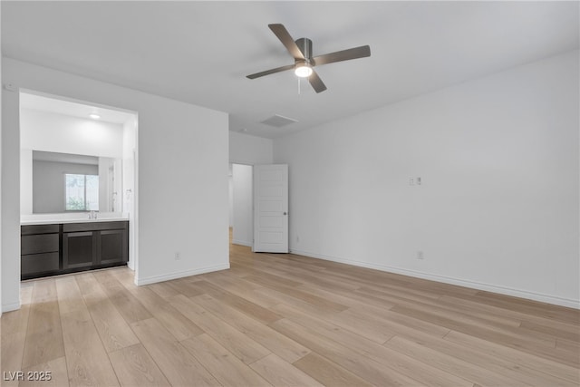 9570 Thistle Creek Ave, Las Vegas, NV 89178 - unfurnished bedroom featuring light wood-style floors, baseboards, and ensuite bath