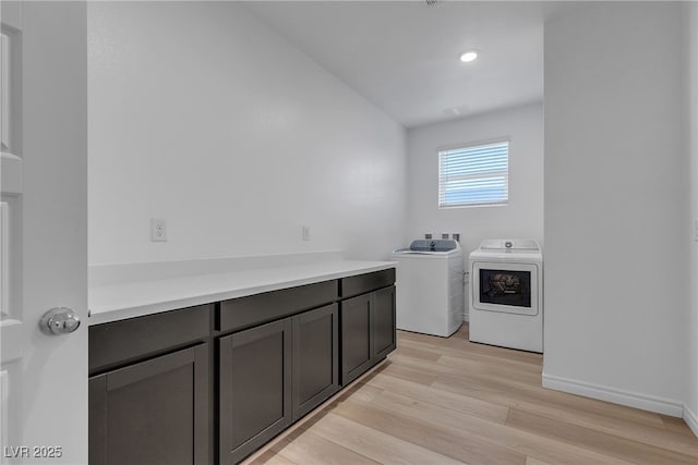 9570 Thistle Creek Ave, Las Vegas, NV 89178 - laundry room with washing machine and clothes dryer, light wood finished floors, cabinet space, baseboards, and recessed lighting