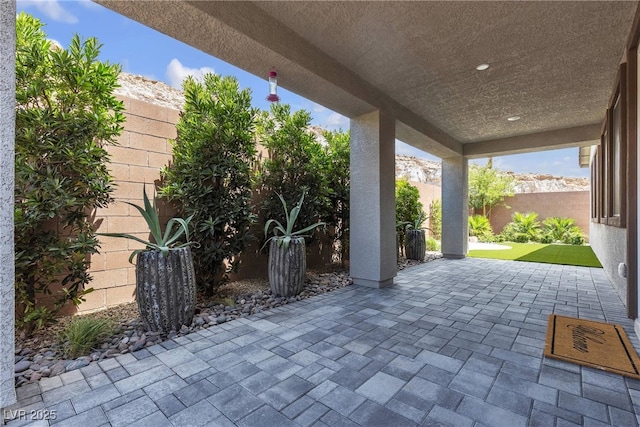 9570 Thistle Creek Ave, Las Vegas, NV 89178 - fenced backyard featuring a patio
