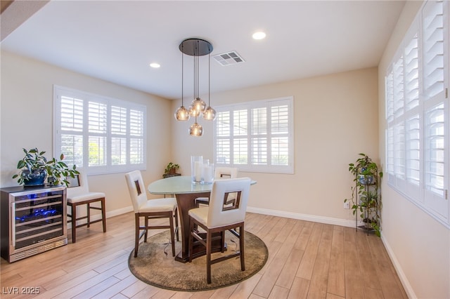 8298 W Agate Ave, Las Vegas, NV 89113 - dining area with beverage cooler, plenty of natural light, light wood-type flooring, and recessed lighting