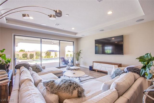 8298 W Agate Ave, Las Vegas, NV 89113 - living area with a tray ceiling, wood finished floors, and recessed lighting
