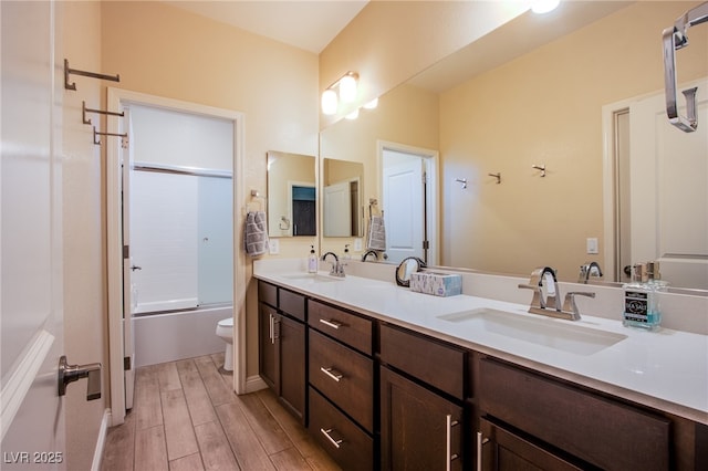 8298 W Agate Ave, Las Vegas, NV 89113 - bathroom with double vanity, wood finished floors, and combined bath / shower with glass door
