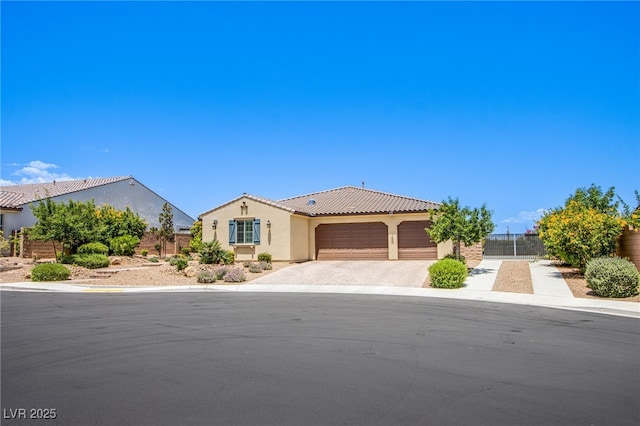 8298 W Agate Ave, Las Vegas, NV 89113 - view of front of property featuring an attached garage, stucco siding, driveway, and a tiled roof