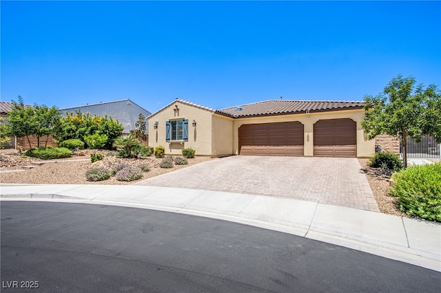 8298 W Agate Ave, Las Vegas, NV 89113 - mediterranean / spanish home with stucco siding, driveway, a garage, and a tile roof