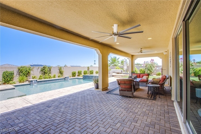 8298 W Agate Ave, Las Vegas, NV 89113 - fenced backyard with outdoor lounge area, a ceiling fan, and a patio