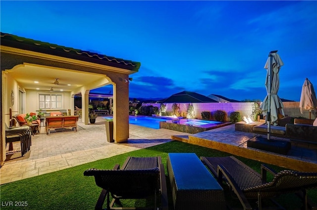 8298 W Agate Ave, Las Vegas, NV 89113 - fenced backyard with a patio area, ceiling fan, an outdoor hangout area, and a pool with connected hot tub