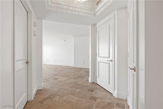 2777 Paradise Rd Unit 1002, Las Vegas, NV 89109 - hall featuring stone tile floors, baseboards, a raised ceiling, and ornamental molding