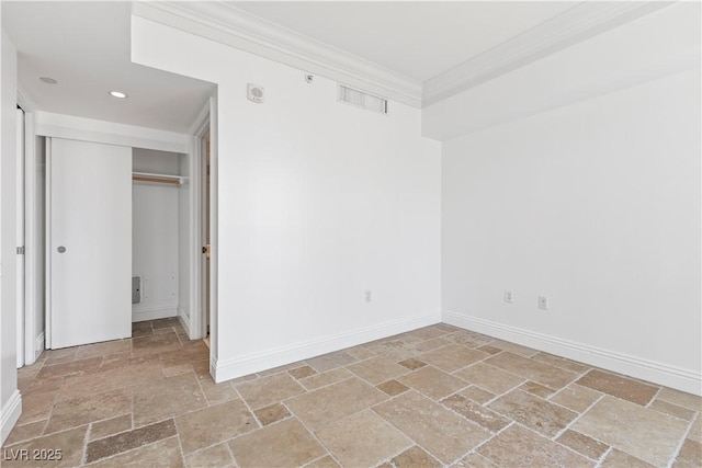 2777 Paradise Rd Unit 1002, Las Vegas, NV 89109 - empty room featuring stone tile floors, baseboards, recessed lighting, and crown molding