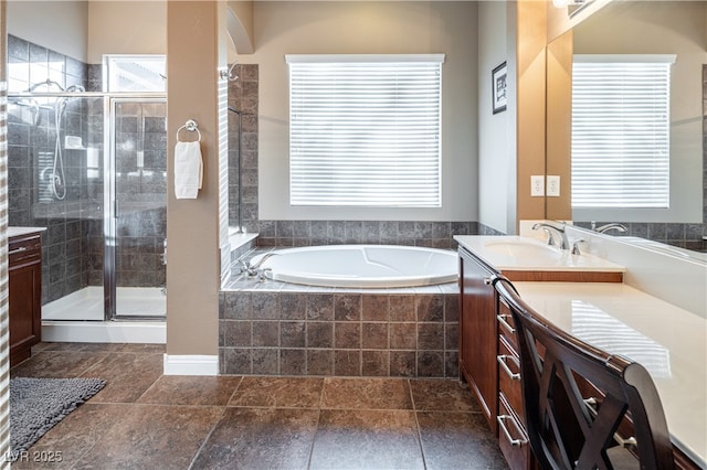 9077 Creed Mountain Pl, Las Vegas, NV 89178 - bathroom featuring vanity, a bath, and a stall shower