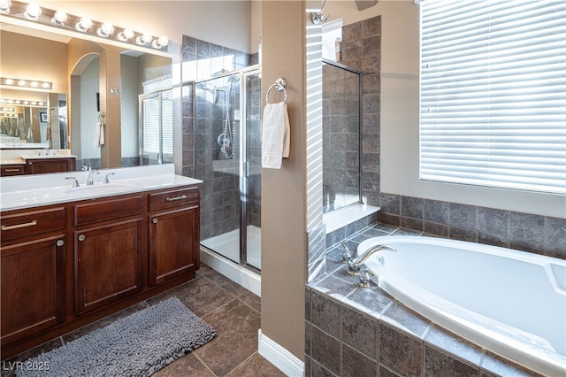 9077 Creed Mountain Pl, Las Vegas, NV 89178 - bathroom with vanity, a garden tub, and a shower stall