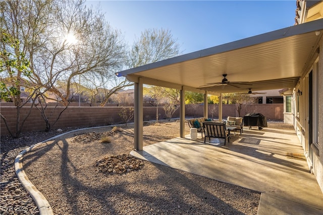 9077 Creed Mountain Pl, Las Vegas, NV 89178 - fenced backyard featuring a ceiling fan, a patio area, an outdoor hangout area, and a grill