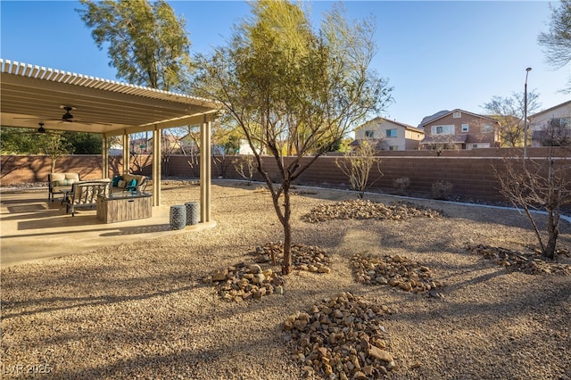 9077 Creed Mountain Pl, Las Vegas, NV 89178 - fenced backyard with a ceiling fan and a patio
