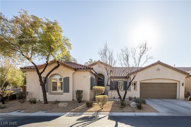 9077 Creed Mountain Pl, Las Vegas, NV 89178 - mediterranean / spanish-style house with a garage, stucco siding, concrete driveway, and a tiled roof