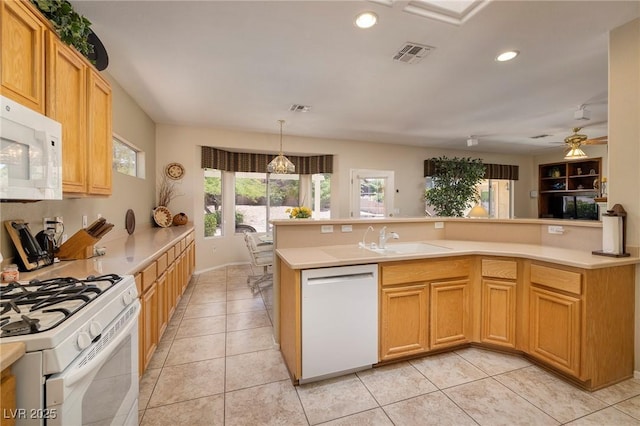 1620 Fieldbrook St, Henderson, NV 89052 - kitchen with white appliances, light countertops, recessed lighting, and light tile patterned floors