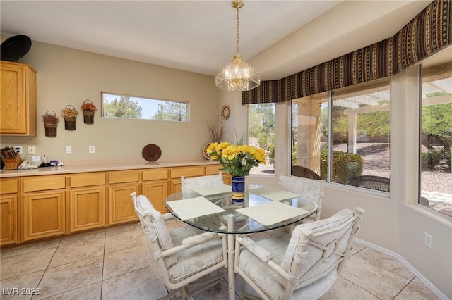 1620 Fieldbrook St, Henderson, NV 89052 - dining area featuring light tile patterned floors and a chandelier