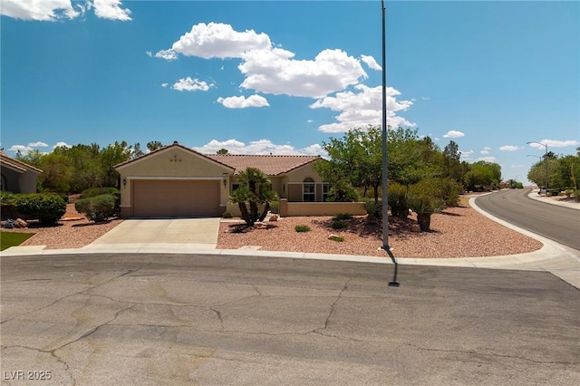 1620 Fieldbrook St, Henderson, NV 89052 - view of front of home with concrete driveway, an attached garage, stucco siding, and a tiled roof