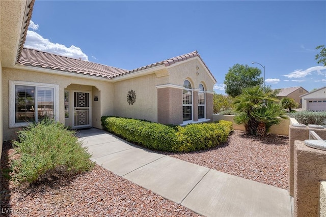 1620 Fieldbrook St, Henderson, NV 89052 - property entrance featuring stucco siding and a tile roof